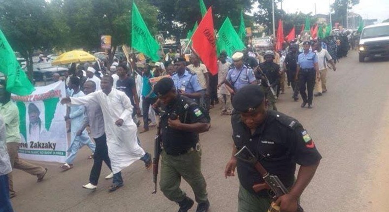 ___8879965___2018___9___20___14___Armed-policemen-following-Free-Zakzaky-protesters-in-Kaduna1-1