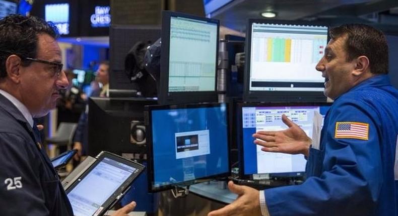 Traders work on the floor of the New York Stock Exchange shortly after the opening of the markets in New York