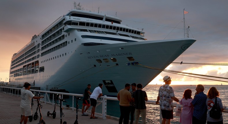 People enjoy Mallory Square as the Regent Seven Seas Mariner cruise ship is docked at the Mallory Square Dock on December 01, 2023, in Key West, Florida.Joe Raedle | Getty Images