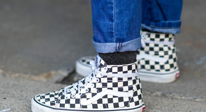 A person wears checkerboard Vans.Edward Berthelot/Getty Images