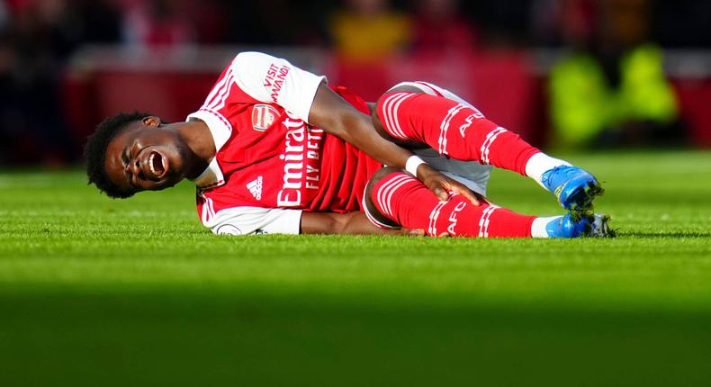 Bukayo Saka of Arsenal reacts after being fouled and eventually is forced off injured on October 30, 2022.