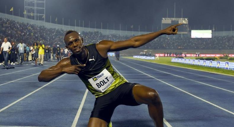 Usain Bolt (C) of Jamaica reacts after winning his final race in home country during the Racers Grand Prix at the national stadium in Kingston, Jamaica, on June 10, 2017