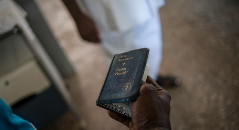 A Nigerian soldier holds a Bible in the substance abuse ward of the Federal Neuro Psychiatric Hospital in Maiduguri, northeastern Nigeria