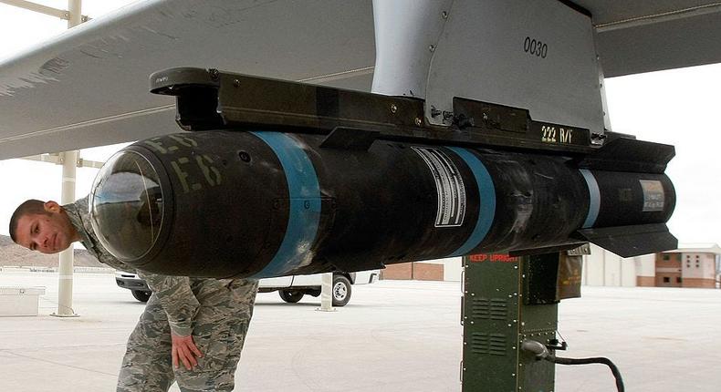 Airman 1st Class Ozzy Toma walks around an inert Hellfire missile as he performs a pre-flight check on an MQ-1B Predator unmanned aircraft system (UAS) April 16, 2009 at Creech Air Force Base in Indian Springs, Nevada.Ethan Miller/Getty Images