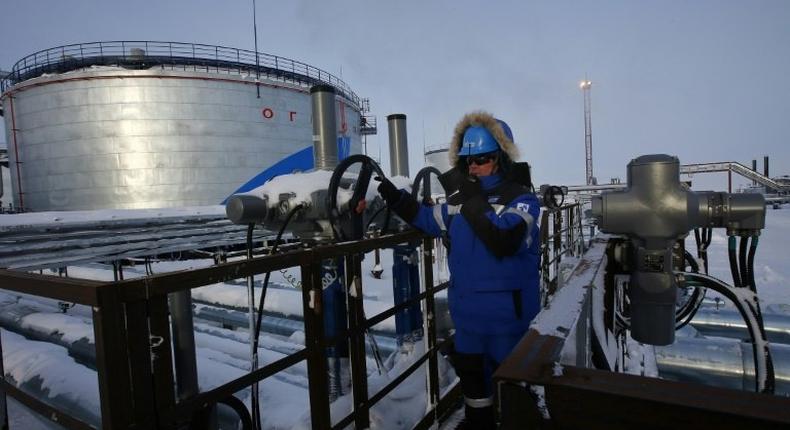 An employee of Russian gas and oil giant Gazprom works in Novoprtovskoye oil and gas condensates oilfield at Cape Kamenny in northern Russia in February 2015