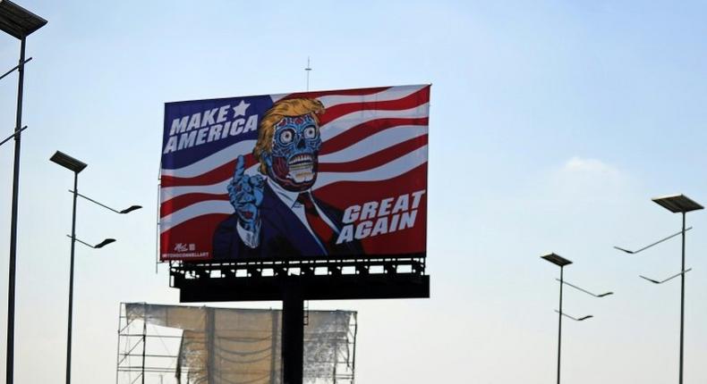 A billboard by US artist Mitch O'Connell depicting President Donald Trump displayed in Mexico City is in allusion and tribute to John Carpenter's 1988 cult movie They Live