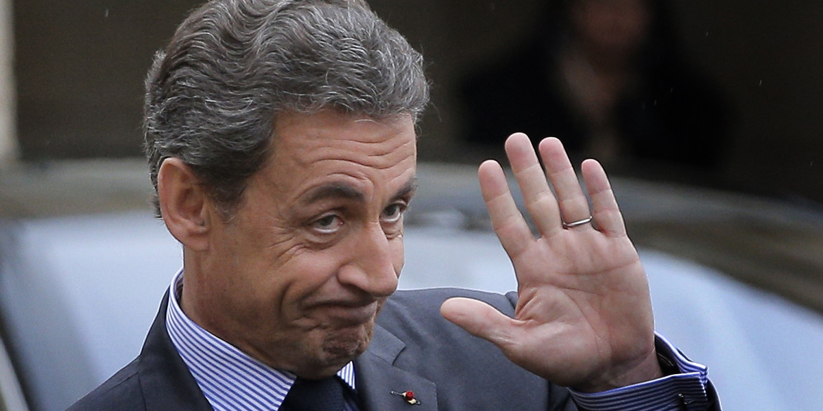 This Friday, Jan. 22, 2016 file photo shows Nicolas Sarkozy, former French President and head of the conservative "Les Republicains" party, left, leaving after a meeting with French President Francois Hollande at the Elysee Palace in Paris, France.