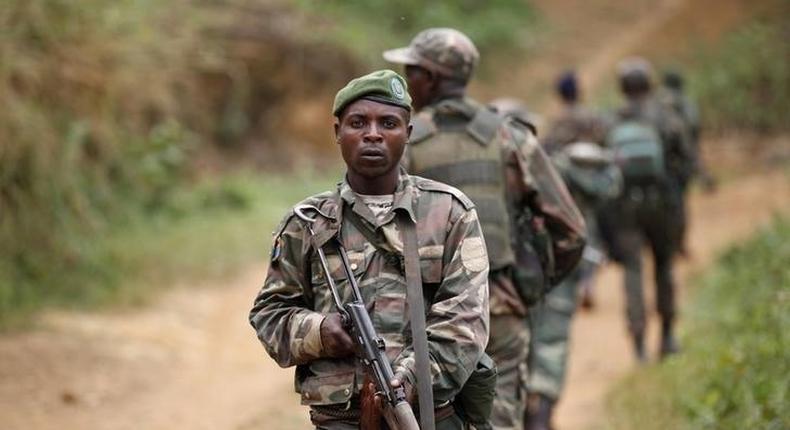 Democratic Republic of Congo military (FARDC) personnel patrol against the Allied Democratic Forces (ADF) and the National Army for the Liberation of Uganda (NALU) rebels near Beni in North-Kivu province, December 31, 2013. REUTERS/Kenny Katombe