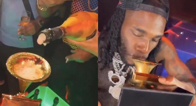 Burna Boy shows up in Nigerian club with Grammy plaque and drinks from it (WATCH)