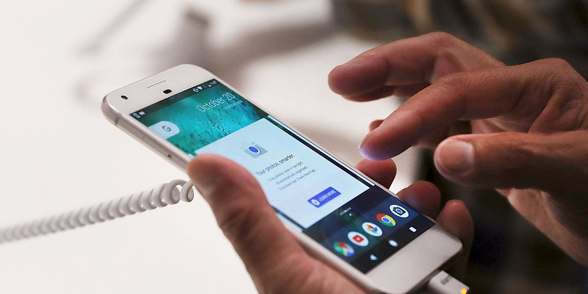 A person trying a new Google Pixel phone at the Google pop-up shop in the SoHo neighborhood on October 20 in New York City.