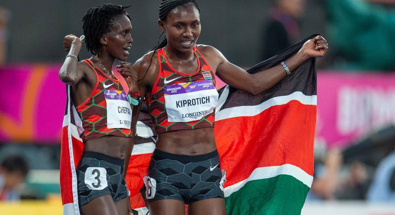 Sheila Chepkirui (R) and Irene Cheptai (L) pose for a photo during the 2022 Commonwealth Games after winning bronze and silver respectively in the 10,000m 