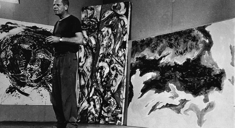 American abstract expressionist painter Jackson Pollock (1912 - 1956) stands amid some large paintings in his studio at 'The Springs,' East Hampton, New York, August 23, 1953.Tony Vaccaro/Getty Images