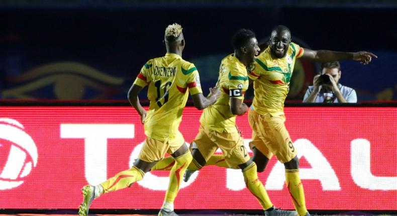 Moussa Marega (R) tucked away a penalty as Mali made a winning start