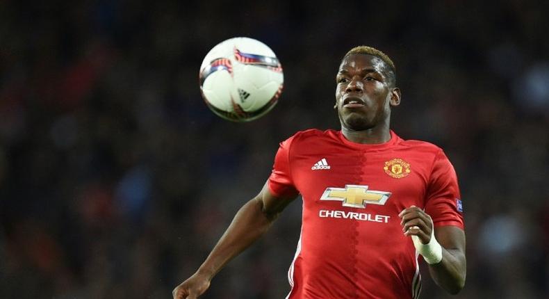 Manchester United's French midfielder Paul Pogba chases the ball during the UEFA Europa League quarter-final match between Manchester United and Anderlecht at Old Trafford in Manchester on April 20, 2017