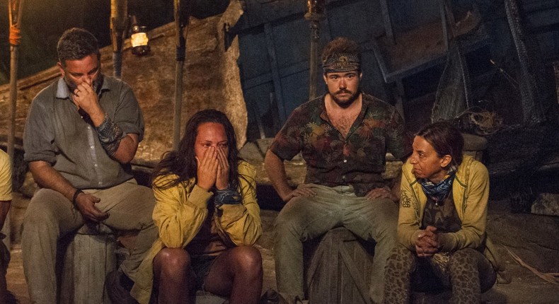 Jeff Varner, far right, surprised Survivor castmates by outing Zeke Smith, far left, during tribal council on the April 13, 2017 episode.