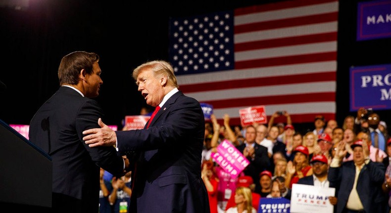 Then-President Donald Trump shakes hands with then-Florida GOP gubernatorial candidate Ron DeSantis during a campaign rally in Tampa, Fla., on July 31, 2018.AP Photo/Evan Vucci