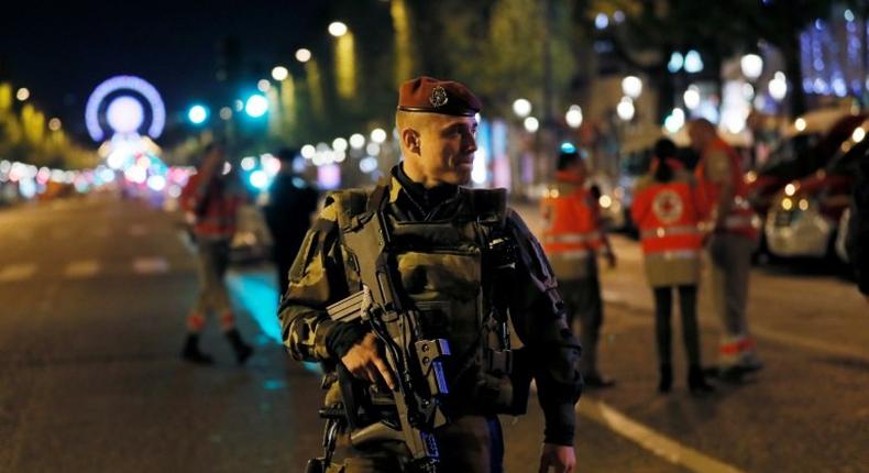 A French soldier patrols on the Champs Elysees in Paris after a shooting on April 20, 2017