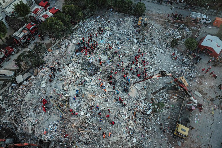 Rescue operations take place on a site after an earthquake struck the Aegean Sea, in the coastal pro