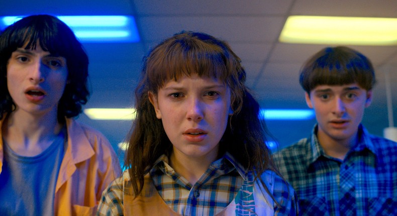 Finn Wolfhard as Mike Wheeler, Millie Bobby Brown as Eleven and Noah Schnapp as Will Byers in Stranger Things season four.