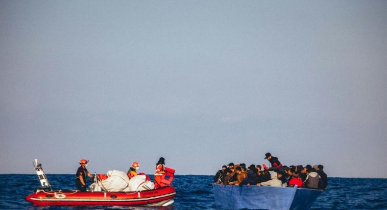 A picture released by German migrant rescue NGO Sea-Eye shows an operation to rescue people in distress off the Libyan coast in April