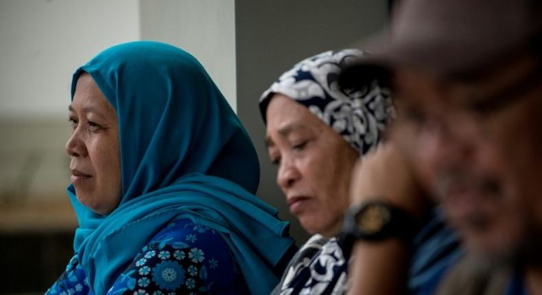 Camalia Baunto (L) waits for news on her husband in Marawi, on the southern Philippine island of Mindanao, on June 15, 2017