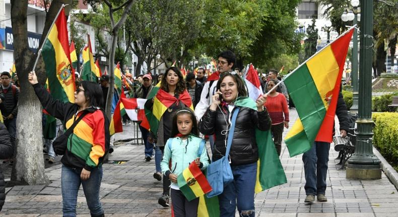 People take to the streets of La Paz to celebrate the resignation of Bolivian President Evo Morales on November 10, 2019