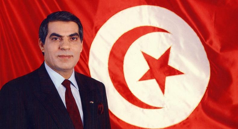 A picture released in April 1998 of Tunisia's ousted president Zine el-Abidine Ben Ali posing for an official picture in front of the Tunisian flag