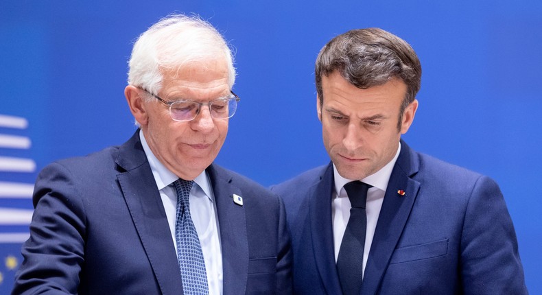 EU security and foreign affairs chief Josep Borrell (left) talks with French President Emmanuel Macron.