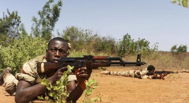 Malian soldiers pause in a firing position during a training session given by soldiers from Luxembourg in Koulikoro May 7, 2013. REUTERS/Emilie Regnier