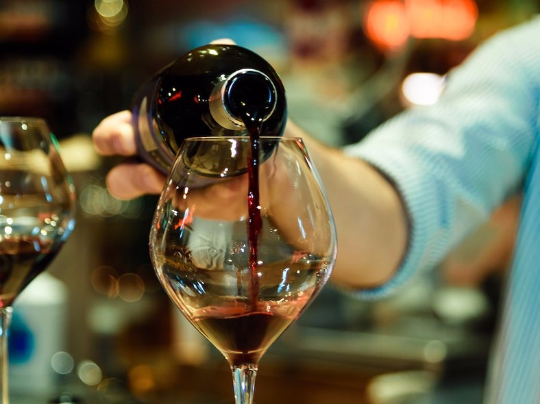 red wine pouring glass 