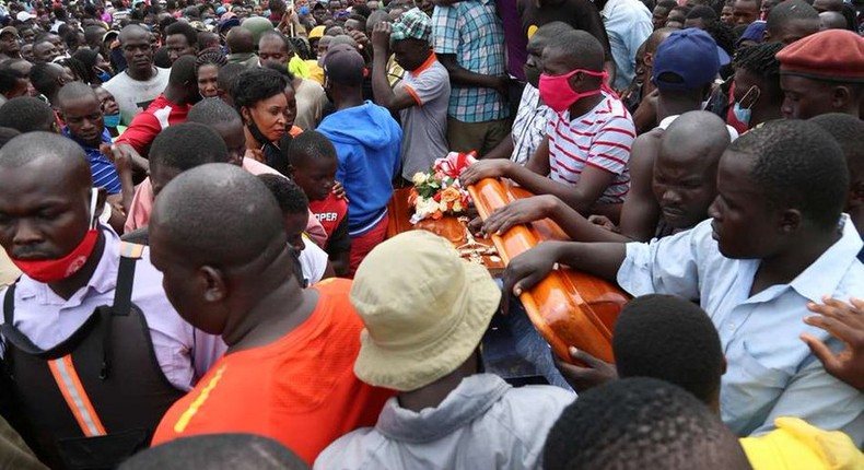 Mourner with Bernard Onyango aka Abenny Jachiga Coffin 