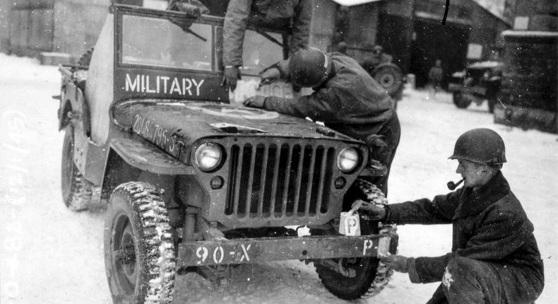 This photo provided by the Ghost Army Legacy Project shows a Jeep getting new bumper markings for special effects For decades, their mission during World War II was a secret.National Archives/Ghost Army Legacy Project via AP