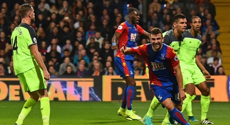 Crystal Palace's Scottish midfielder James McArthur (3rd R) celebrates after scoring his second goal during the English Premier League football match between Crystal Palace and Liverpool at Selhurst Park in south London on October 29, 2016