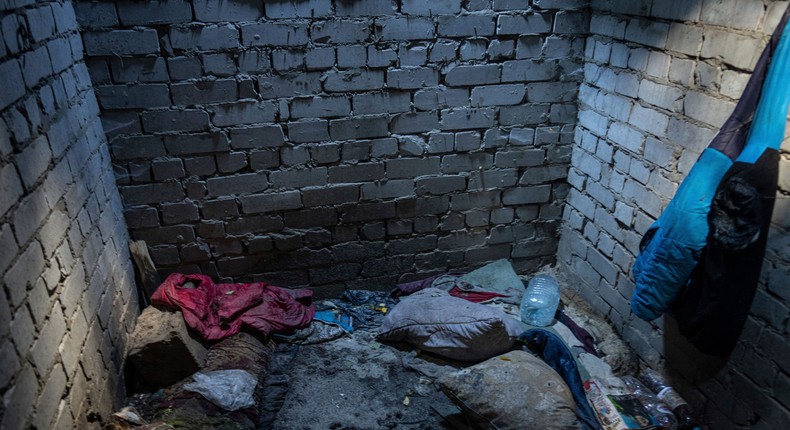 Items left behind sit in the deep sunless pit, used for torture by Russian soldiers, in a residential compound in the recently liberated town of Izium, Ukraine, Tuesday, Sept. 20, 2022.