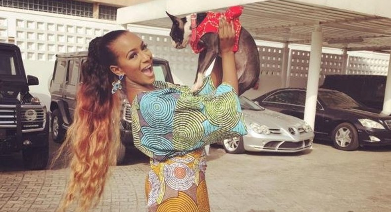 DJ Cuppy in front of her garage.