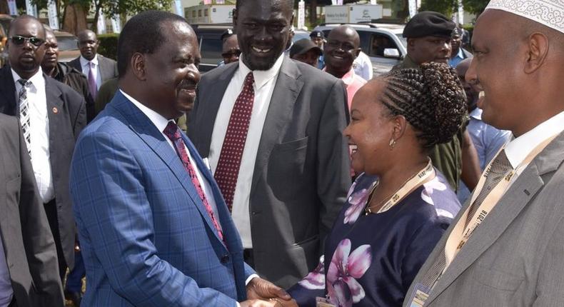 Raila shakes hands with Governor Waiguru during 2018 Devolution Conference