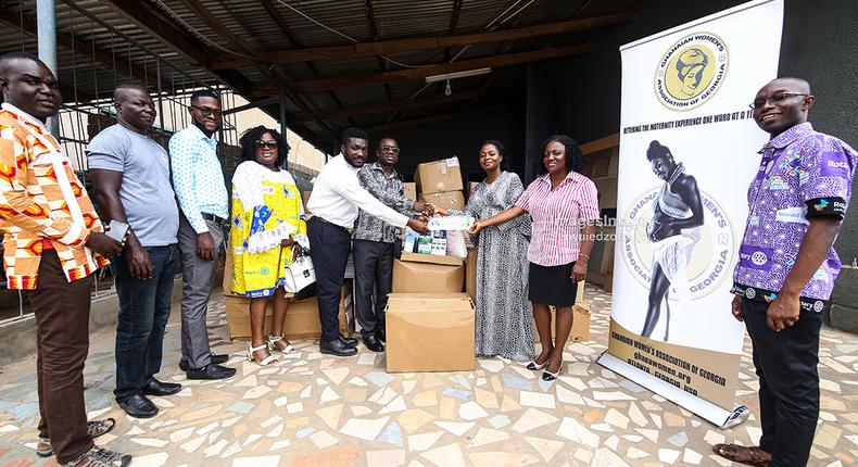 GWAG representatives (from right) Pearl Aglago and Mrs. Nayram Kyei-Mensah present the items to Mr. Mensah-Acheampong (3rd from right), as President of the Accra Airport City Rotary Club, Mr. Spencer Asamoah (4th from right) looks on. 