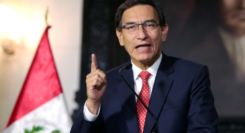 Peru' Congress voted to open impeachment proceedings against President Martin Vizcarra (shown September 10, 2020 in a handout picture from the Peruvian Presidency) for moral incapacity over accusations he incited aides to lie to investigators