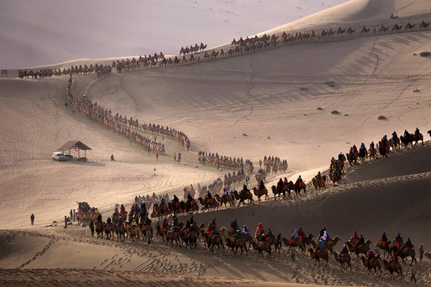 Tourists Visit Sand Dunes IN China