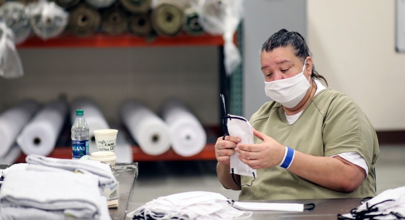 An inmate makes a facemask at Las Colinas Women's Detention Facility in Santee, California
