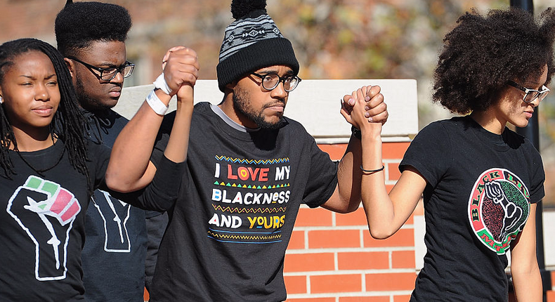 Jonathan Butler, a University of Missouri grad student who did a 7-day hunger strike, is greeted by a crowd of students on the campus of University of Missouri - Columbia on November 9, 2015.