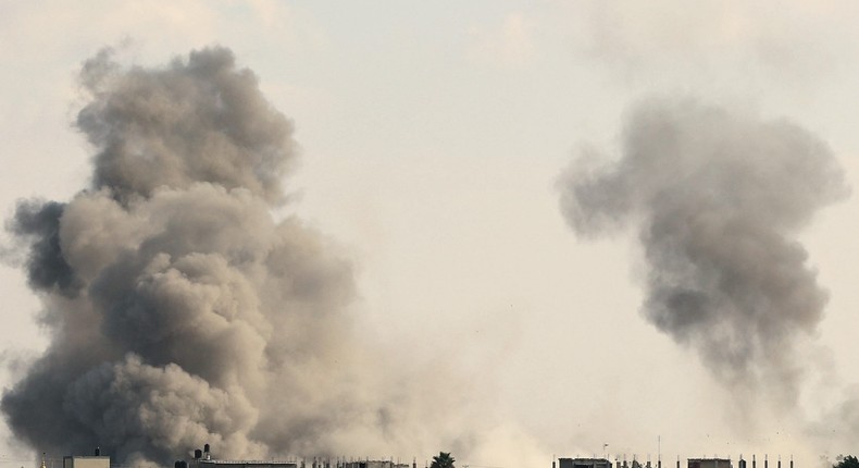 Smoke billows from the Gaza's Rafah border crossing with Egypt during an Israeli airstrike on October 10, 2023. Gaza's border crossing with Egypt, its only one that bypasses Israel, was hit by an Israeli air strike on October 10, 2023 for the second time in 24 hours, witnesses and a rights group said. Witnesses said the strike hit the no-man's land between the Egyptian and Palestinian gates, damaging the hall on the Palestinian side.SAID KHATIB/AFP via Getty Images