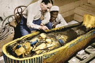 Howard Carter (1873-1939) english egyptologist near golden sarcophagus of Tutankhamon (mummy) in Egy