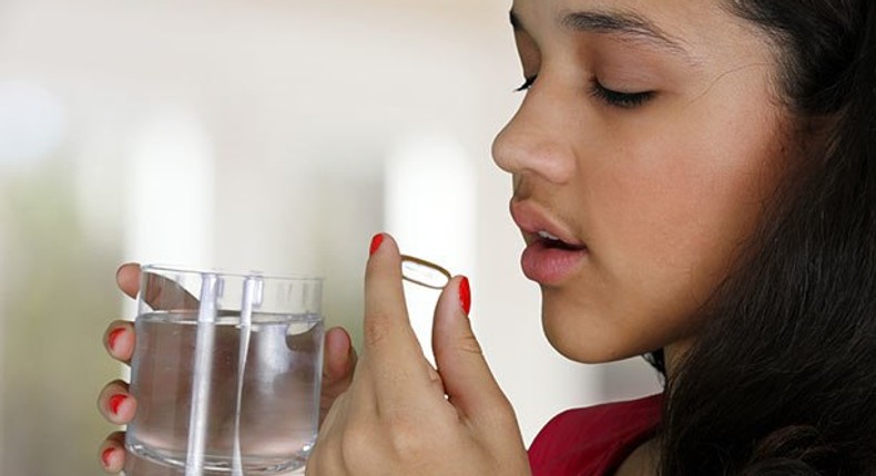 Woman taking a laxative