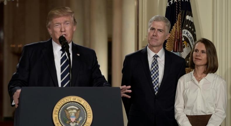 Judge Neil Gorsuch (C) and his wife Marie Louise look on, after US President Donald Trump nominated him for the Supreme Court, at the White House in Washington, DC