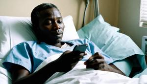 AI generated image of a patient-in-a-hospital-bed-holding-a-phone