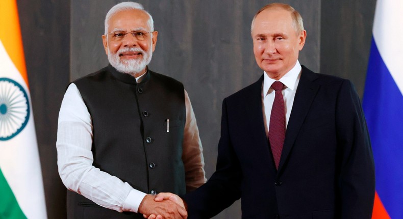 Russian President Vladimir Putin, right, and Indian Prime Minister Narendra Modi pose for a photo shaking hands prior to their talks on the sidelines of the Shanghai Cooperation Organisation (SCO) summit in Samarkand, Uzbekistan, Friday, Sept. 16, 2022.