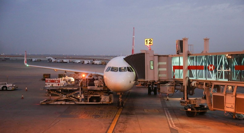 A plane waits at the gate at King Khalid International Airport in Riyadh, in Saudi Arabia.NurPhoto / Contributor / Getty