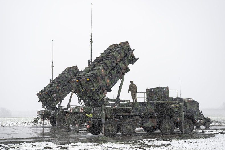 Soldiers of the German Armed Forces stand on a trailer with launching pads for guided missiles of the Patriot air defense system on a snow-covered field in southeastern Poland.Photo by Sebastian Kahnert/picture alliance via Getty Images