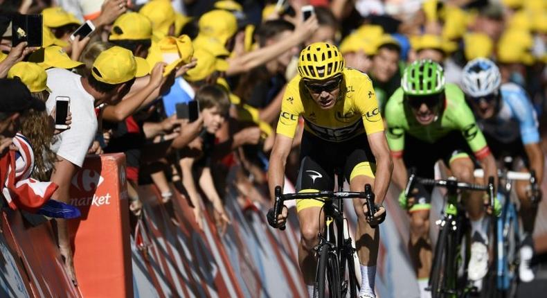 From L: Great Britain's Chris Froome, Colombia's Rigoberto Uran and France's Alexis Vuillermoz ride towards the finish line on July 16, 2017